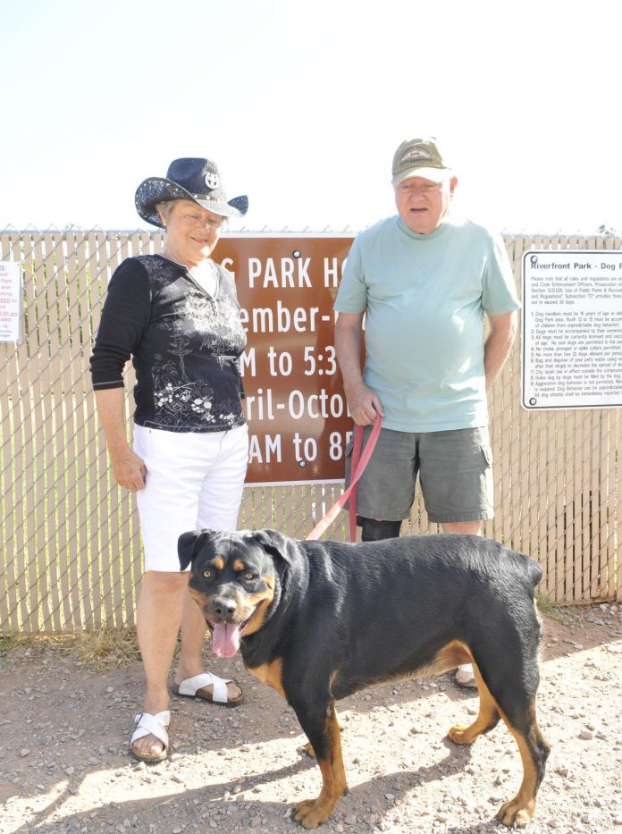 Rob and Yvonne Cole stand with their 2-year-old rottweiler, Cami, in front of the Cottonwood Dog Park, ready to go play. State Bill 1248 was recently signed into law, making it so that parks may not discriminate against “vicious” breeds like rottweilers and pit bulls, instead regulating on a case-by-case basis.