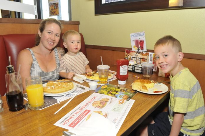 Sarah Hall of Cornville took her boys Everest, 2, center, and Tristen, 6, out for breakfast at a local restaurant. The Farm to Fork program aims to get locally-grown food into restaurants, grocers and schools.