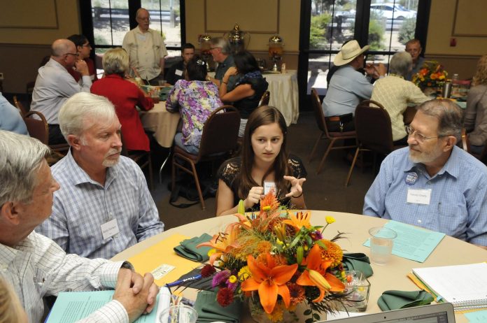 Mackenzie King, center, is a junior at Mingus Union High School. As one of the youngest people at the table, her views and ideas on technology were highly valued. She sat between incoming Yavapai County District 3 Supervisor Randy Garrison, left, and Harvey Grady, a nonprofit organizer.