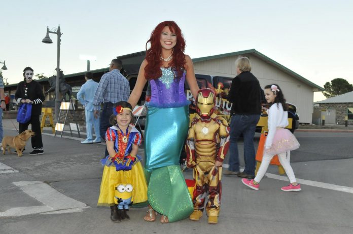 The Beelers were a Disney family for Halloween last year. Rachelle Beeler went as the Little Mermaid, while kids Kenzie, left, was Snow White, and Carter was Iron Man.