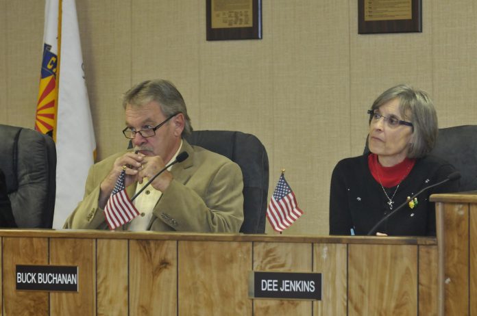 New Camp Verde Town Council members Buck Buchanan, left, and Dee Jenkins listen to a presentation concerning the amendment of a tax code. The amendment allows for an exemption of sales tax for the purchase of seed and chemical spray, feed for animals and animals bought for slaughter.