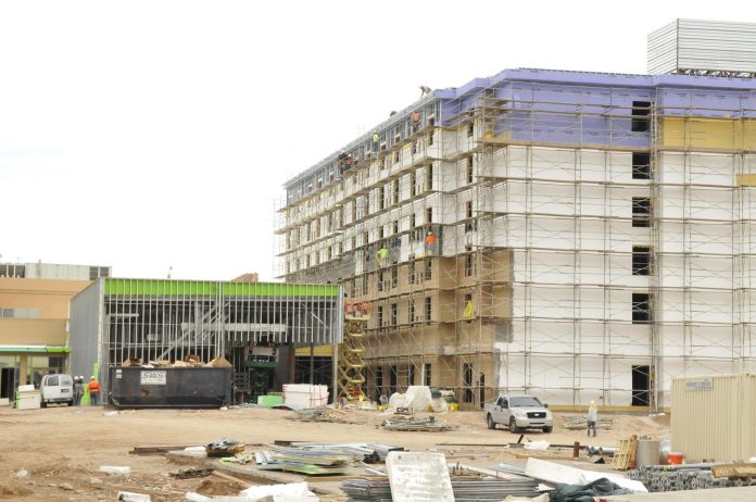 Workers operate from scaffolding outside of Cliff Castle Casino’s new hotel. The smaller structure to the left will house an in-ground pool. The new hotel building is expected to be open in April, and on New Year’s Eve, the casino will unveil its new 5,000-square-foot multipurpose room, along with its 300-car parking garage.