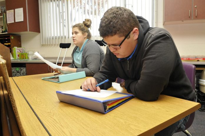 Mountain View Prep students Kayla Stewert, left, and Marco Castrita complete a quiz on chemical mixtures, solutions and what will dissolve, before moving onto the conservation of mass in Kelli Rhoda’s eighth-grade science class. In November the school was named one of the 25 school semifinalists in the second annual Northrop Grumman Foundation Fab School Labs contest, aimed at promoting STEM education by awarding five grants of up to $100,000 each.