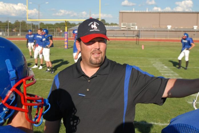 Head Coach Luke Steege gives instructions to his team during pregame warm-ups in Payson on Friday, Aug. 20. Steege believes his Camp Verde High School football team could be 7-3 this season.