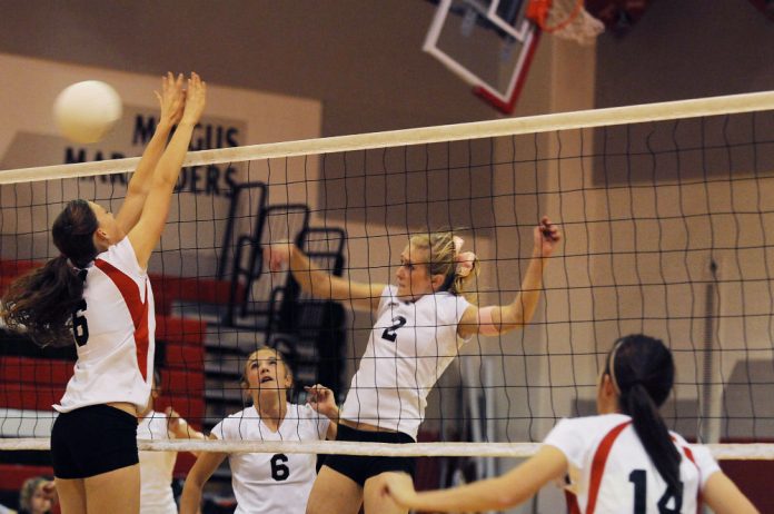 Amanda Randolph slips one past a Coconino High School blocker to score a point during Mingus Union High School volleyball team’s last home game of the 2010 regular season Thursday, Oct. 28. The Marauders took the match in three quick but close games.