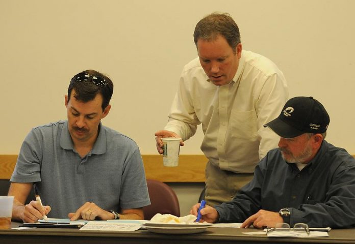 Camp Verde Town Manager Russ Martin, center, brainstorms ideas for issues surrounding the recently passed medical marijuana initiative with Lt. Earl Huff of the Camp Verde Marshal’s Office, left, and Mike Jenkins, Camp Verde Community Development Director, during a meeting of MATForce members and community leaders from across the Verde Valley and Prescott at the Cottonwood Public Safety Building on Dec. 8. MATForce is trying to have a voice in how medical marijuana issues are handled within Yavapai County.