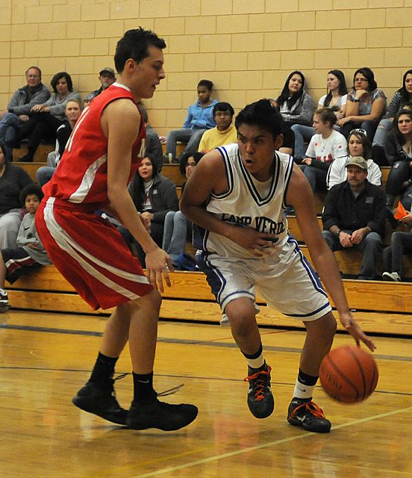 Junior Johnny Hudson drives to the basket in a game Dec. 17. Hudson scored 12 points and had two rebounds in the 56-42 win over Payson High School in the Alvarez Tire Holiday Hoops Classic finale Dec. 29.