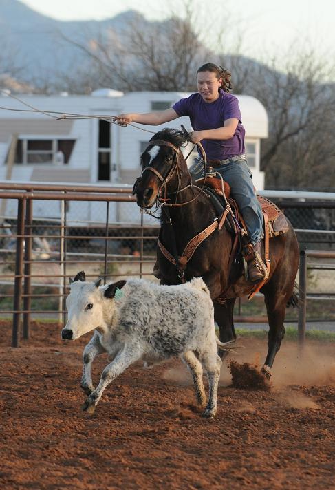 Camp Verde’s Danya Weir practices her skills at tie-down roping at her family’s arena Jan. 13. Danya and her mother, Daria Weir, are both accomplished rodeo ropers.