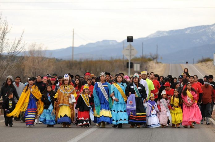 Yavapai-Apache Nation members march solemnly Saturday, Feb. 26, on Montezuma Castle Highway to commemorate the suffering the Yavapai, or Wipuhk’a’bah, and Apache, or Dil’zhe’e, peoples endured during their forced relocation from the Verde Valley to San Carlos. Exodus is observed every year.