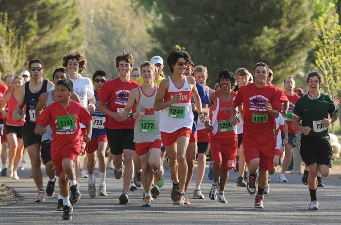 Runners in the 10K portion of the third annual Brian Mickelsen Memorial Run/Walk are all smiles as they start the race from Riverfront Park in Cottonwood on Saturday, April 16. Nearly 600 were in attendance to participate in the race.