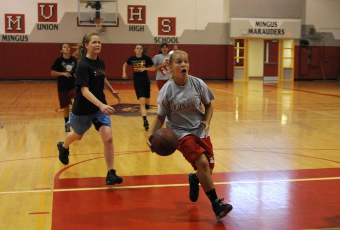 Desi Ortiz, right, goes up for a layup during practice Friday, June 3, with the Mingus Union High School girls summer basketball team. Ortiz and the rest of the Marauders are looking to get better this June during the summer season.