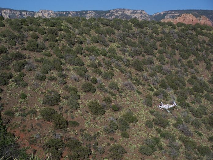 An Embraer Phenom 100 charter jet crash landed at the Sedona Airport and slid to a stop about 300 feet down from the runway of Airport Mesa. Three passengers and two pilots sustained only minor injuries in the crash and hiked up the mesa on their own.