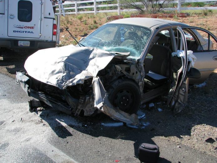 A gold sedan and a westbound cable truck collided in the early morning Wednesday, May 9. The driver of the sedan, 72-year-old Hakim Amin, was flown to Flagstaff, but died later in the evening. His two 9-year-old children and the 22-year-old driver of the cable truck were also injured. Emergency crews prepare to airlift a patient following the crash.