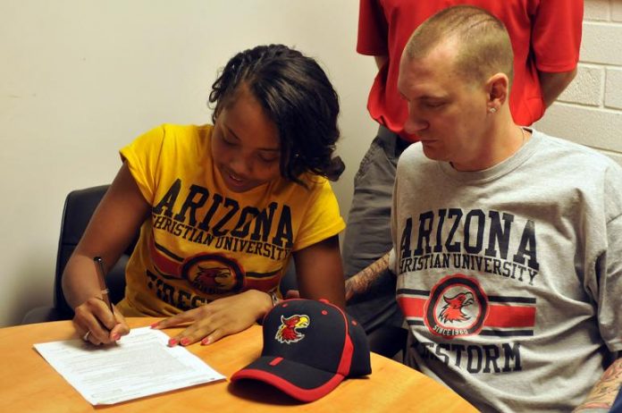 Seairah Ebert signs a possible full ride Academic and Basketball scholarship with Arizona Christian University with her father Jeremy at her side on Thursday, May 2, at Mingus Union High School in Cottonwood.