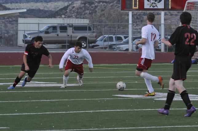 Junior Orlando Machado, No. 22, second from left, moves up to boom a kick out of the Mingus Union High School zone while junior Hector Zapata, No. 12, moves out of the way during the Marauders’ 6-0 home victory over Page High School on Tuesday, Jan. 15.