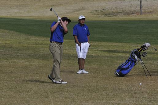 Junior Bodie Holowell, left, and sophomore Joel Beauty check their shots for Camp Verde High School’s golf team on the first hole of Verde Santa Fe Golf Course during a 24-stroke match victory for the Cowboys over Arizona College Prep on Thursday, March 20.