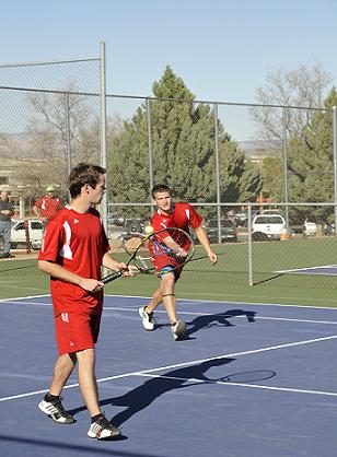 Senior Tanner Caron returns the ball across the court as fellow senior Gary Baker waits, ready for the next volley Tuesday, March 18, at home against Sedona Red Rock High School.