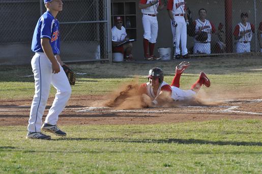 Junior Orlando Machado slides into home for an inside-the-park home run during Mingus Union High School's 14-4 victory Tuesday, March 11, over Thunderbird High School