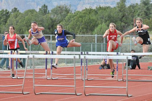 Senior Maddy Showers, center, hurdles for the Camp Verde High School track team at the Sedona Friendship Meet last season. Head coach Lori Showers said that due to lack of available hurdlers like Showers, the team will not have any entries in competition this season. Because of the smaller roster, the team will travel to Wickenburg instead of the Skydome Classic.