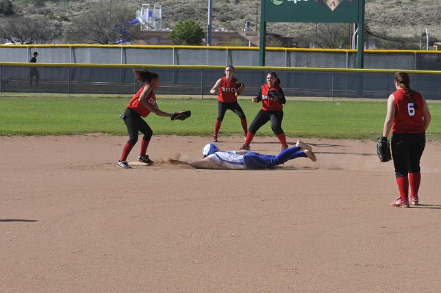 Caitlin Harris, one of four seniors who played their last home game April 16 for Camp Verde High School in a 15-0 three-inning shutout of Cortez High School, slides into second base in a close play against the Colts.