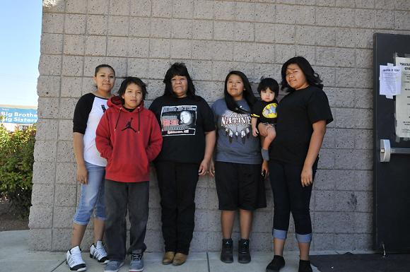 Orlando Lewis’ family celebrates his life Saturday, April 12, at the fourth annual Orlando Lewis Memorial Basketball Tournament. Sister Lashonna Lewis, brother Tommy Jackson, mother Peggy Mocasque, sister Shushandalynn Lewis, nephew Gavin Trujillo and sister Shenaya Lewis, from left, stand outside the doors of the Middle Verde Recreation Gym.