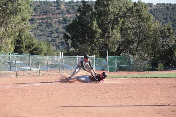 Third baseman Ethan Brogdan just misses the tag of West Sedona School runner Angel Betancourt in the Clarkdale Jerome School’s 8-7 loss April 10, at West Sedona.
