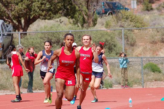 Senior Justine Taylor, front, and junior Allison Whitworth fail to connect on the final baton pass in the 4x100 meter relay Saturday, April 5, disqualifying the Mingus Union High School girls track team from that event at the Red Rock Invitational at Sedona Red Rock High School. Taylor, though, would rebound to place first in the 100- and 200-meter dashes.