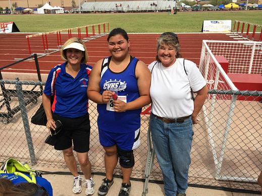 Junior Viola Logston, center, assistant coach Pam Edgerton, right, and head coach Lori Showers enjoy the afterglow of Logston’s shot put silver medal in the Division III state track and field tournament Friday, May 9, at Mesa Community College. Logston threw a personal-best 38 feet, 2 inches in the competition and also threw 97 feet to finish sixth in the state in the girls’ discus.