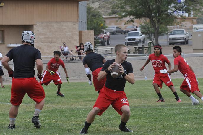 Jordan Upham, an incoming Mingus Union High School junior, third from right, pulls back and launches the ball during a seven-on-seven touch football game against Mesa Mountain View High School on Friday, June 26, at Camp Verde High School. Sophomore Trey Meyers filled in at quarterback for Upham during the Marauders’ final seven-on-seven series of games Monday, June 30, at MUHS.
