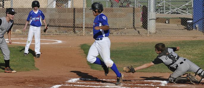 Shortstop Rafael Zapata, No. 22, just beats the tag of the Chino Valley catcher and scores for the Camp Verde Junior Little League All-Stars in their 7-3 win over Chino Valley to capture the District 10 championship July 11. The 13- and 14-year-old Diamondbacks won Camp Verde Little League's first-ever game at State in finishing in ninth place.