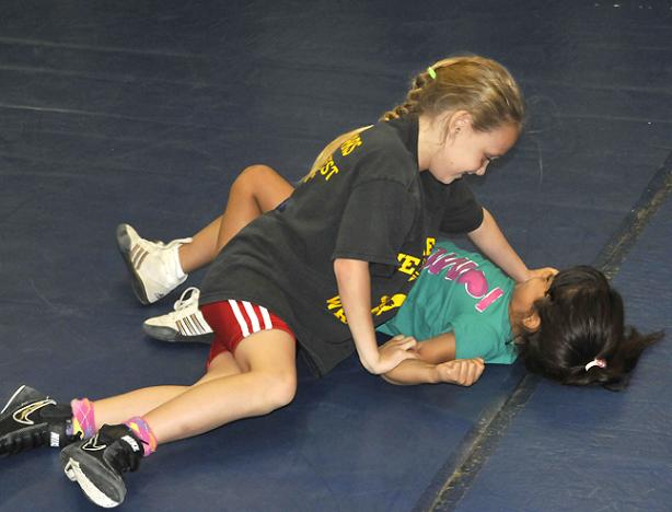 Shane Navarro, left, a third-grader at Camp Verde Elementary School, and first-grader Mayra Guillen are the only girls in Camp Verde's wrestling program. Both wrestlers have captured two first-place awards at 40 pounds at this summer's Weekend Wars competitions.