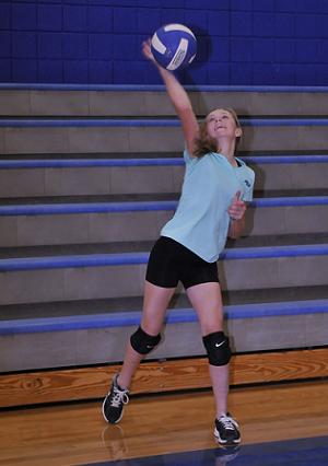 Eighth-grader Rachel Stockseth practices her overhand serve for the A team in the Camp Verde Middle School gym during volleyball practice.