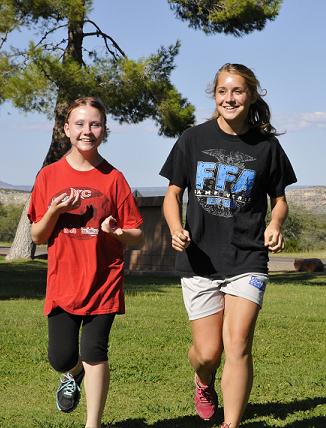 Senior Katelin Wade, left, and sophomore Rylee Smith run together at the beginning of cross-country practice at Camp Verde High School. The boys and girls teams will host two home meets in the next 10 days, including a meet Wednesday, Sept. 17, against Coolidge High School and Arete Preparatory Academy, from Gilbert.
