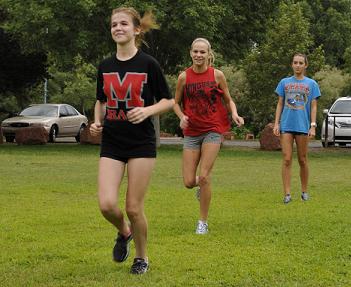 Mingus Union High School's cross-country team has resumed practice in preparation for its opening meet Wednesday, Sept. 3, at the Payson Invitational. Sophomore Cassia Gehl, front, freshman Sydney Alexander, middle, and junior Megan Goettl are put through their paces with the rest of the team at Riverfront Park in Cottonwood.