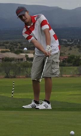 Sophomore Travis Nester chips onto the practice green at Verde Santa Fe Golf Course for Mingus Union High School in the practice before the Marauders' home match Wednesday, Sept. 10, with Liberty and Mingus Union high schools.