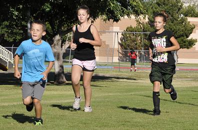 After a series of stretches and jumping-jacks to warm up, the Camp Verde Middle School cross-country team runs two laps around Butler Park. Cowboys sixth-grader Maya Hedges ran the Verde Valley Conference finals course in 10 minutes to place first overall.