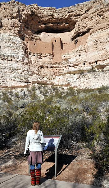 Visitor Serena Lynch reads informational material at the base of Montezuma Castle in Camp Verde. The Sinagua built the cliff dwelling on the east face of the limestone wall beginning around A.D. 1125 before abandoning the area around A.D. 1420. According to National Park Service statistics, Montezuma Castle had more than a million visitors in 1996. Since then, however, it has steadily declined, hosting 389,091 in 2013, its lowest visitation since 1979. About 31.3 million people have visited the monument since it began counting them in 1920.