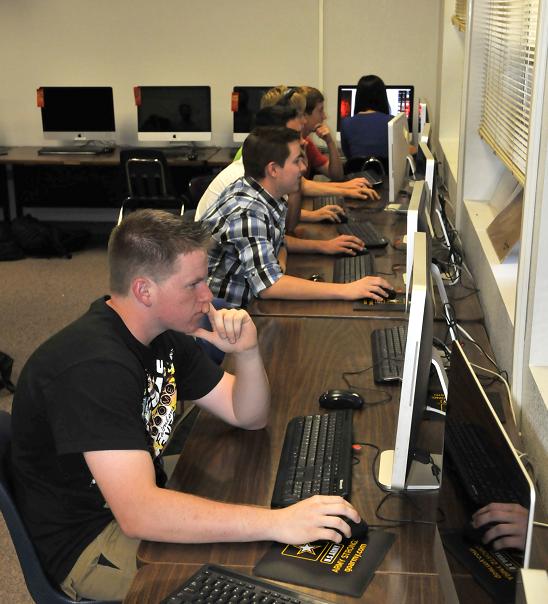 Students in Tina Scott’s digital media class busily work on projects during sixth period. While the school days are slightly longer, the four-day school week has been well received.