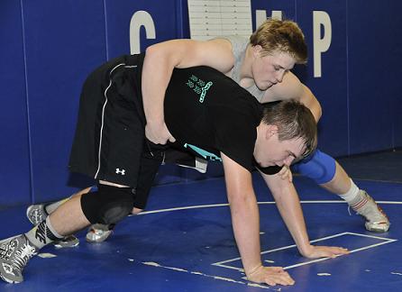 Curtis Corder wrestles against fellow senior Brett Worth at Camp Verde High School wrestling practice. Worth and two other senior football players who haven't wrestled before are competing for a varsity spot in the middle or upper weight classes.