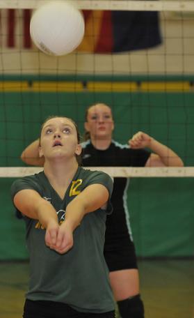 Eighth-grader Mia Williams turns her back on Big Park Community School but keeps her eyes on the ball for host Clarkdale-Jerome School at the State Small Schools Volleyball championships Saturday, Nov. 1. The Mingus Rams would beat Big Park for the third time this fall.