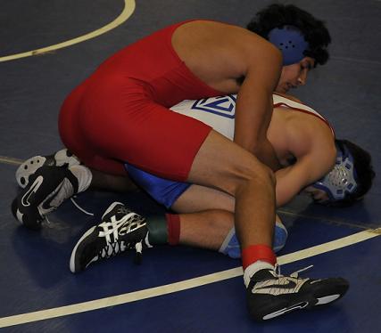 Junior Ethan Kim, top, wrestles for Mingus Union High School against Camp Verde High School sophomore Hulices Felix in a Dec. 10 dual at CVHS. Kim pinned Felix at the last minute.