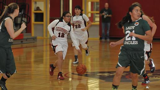 Sophomore Destiny Razo, No. 12, leads the Mingus Union High School break with support from older sister Angelyna, No. 22. The Marauders snapped a three-game losing streak Saturday, Dec. 27, with a win at the Lady Titan Winter Hoops Classic in Scottsdale.