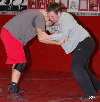 Seniors Cordell McKeever, right, and Andre May, square off during practice. While McKeever has a knee injury and has yet to wrestle this season, May was pinned in a 63-12 loss at Chino Valley High School.