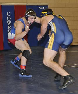 Ryan Allred, a senior for Camp Verde High School, left, won his third most outstanding wrestler award of the season and 30th match overall, taking the 152-pound title after four championship round victories Dec. 30 at the Mile High Challenge in Prescott Valley.