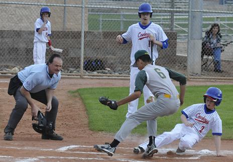 Eighth-grader Noah Church of the Camp Verde Middle School baseball team slides into home safely during the Cowboys’ first game of the season Thursday, Feb. 26, against Clarkdale-Jerome School. The Cowboys defeated the Mingus Rams in the opener, 14-2.?