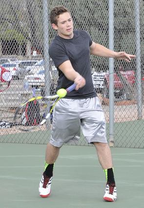Logan Connella, a junior on Mingus Union High School’s boys tennis team, returns a serve during practice. Connella is currently the No. 2 singles player on the Marauders’ varsity ladder.