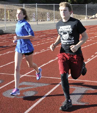 Sophomore Cassia Gehl, left, and junior Alec Phyfer train with the rest of the Mingus Union High School runners. Gehl and Phyfer train for endurance over sprinting speed. Gehl’s main events are the mile and half-mile run, while Phyfer’s is the 300-meter hurdle.