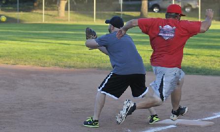 During the Cottonwood Parks and Recreation department’s church spring league game Friday, July 10. Verde Valley Baptist Church’s Anthony Franklin, right, tagged first a split-second before Paul Ventura, of Immaculate Conception Catholic Church, caught the ball. The league was resurrected by the Cottonwood Recreation Center after a two-year hiatus.