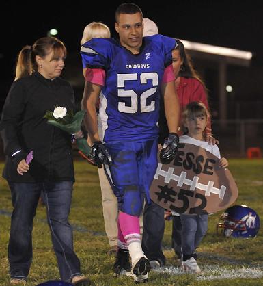 Senior linebacker Jesse Etienne, accompanied by mother Sarah, left, along with his Rimrock family on Senior Night, finished the season ninth in Division V in tackles as Camp Verde High School defeated Mohave Accelerated Learning Center, 28-21. Etienne, whose parents allowed him to transfer to CVHS to help care for an aunt in Rimrock, tied for second on the team in tackles in the win Friday, Oct. 30.