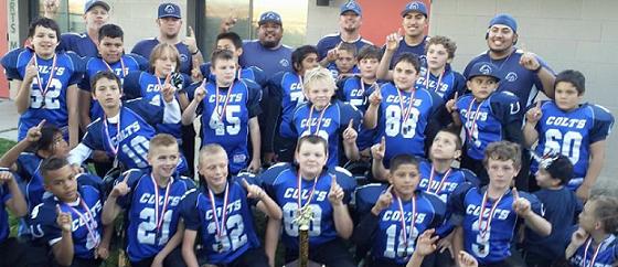 The Cottonwood Colts celebrate Saturday, Nov. 7, after their 31-13 win over Wickenburg for the Northern Arizona Youth Football championship in the Minors division. The Colts finished their season with one loss.